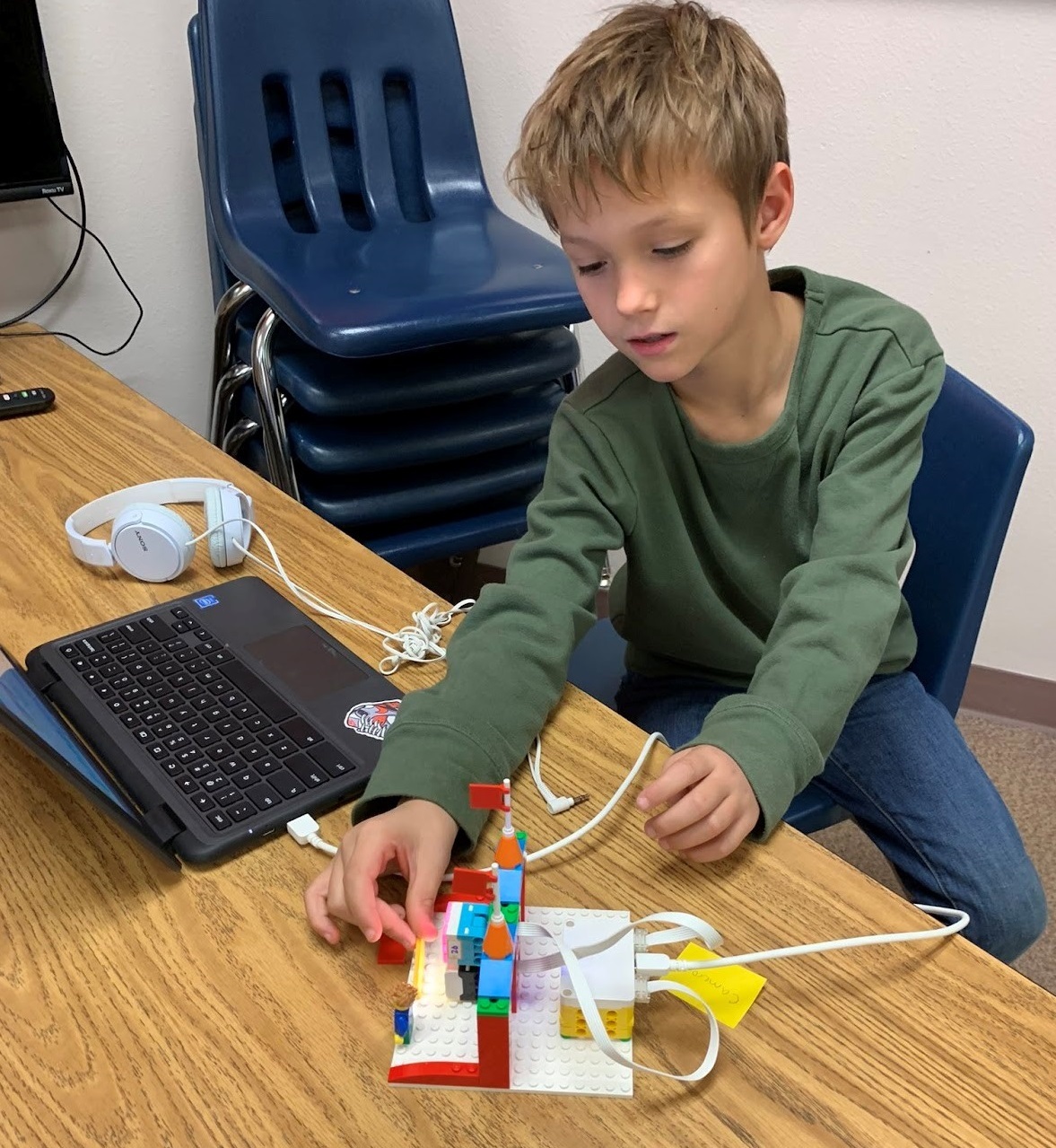 A 3rd-grade student works on programming a LEGO Spike project